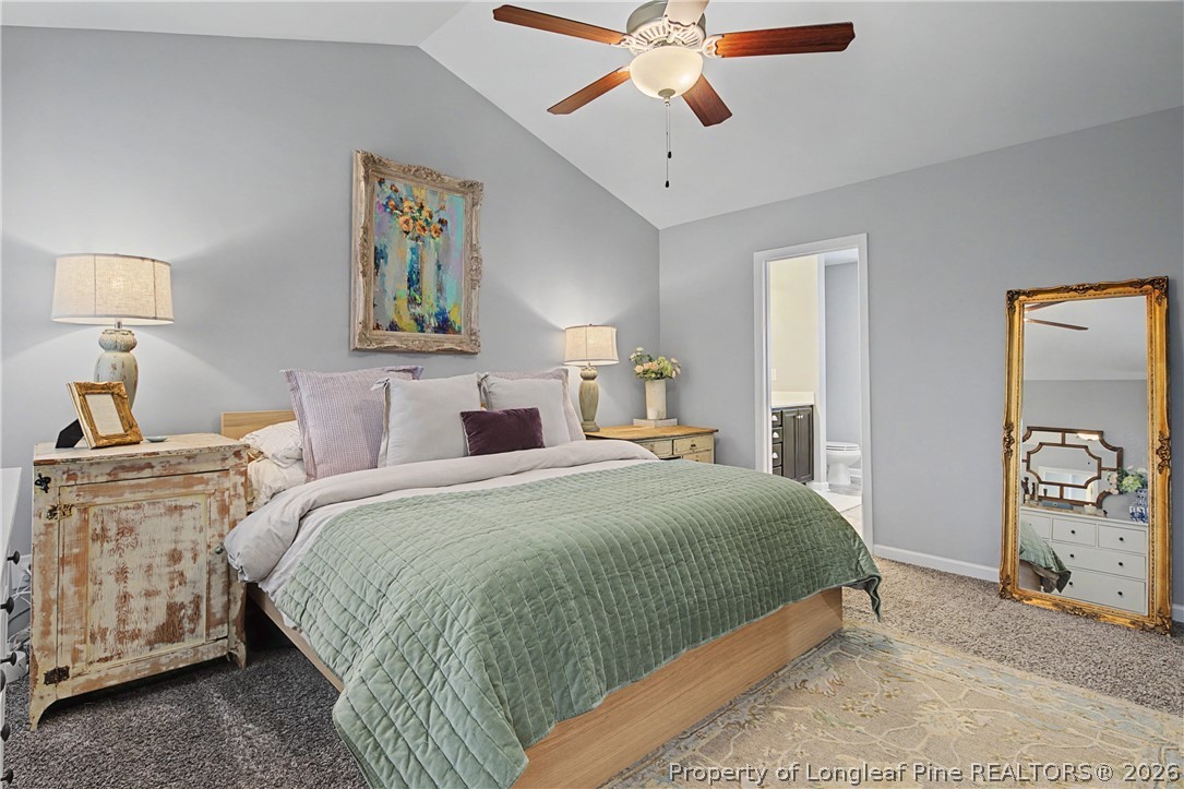 143 Ledgebrook Lane Raeford, NC 28376 - Photo 27 of 50 a bedroom with a bed and a chandelier