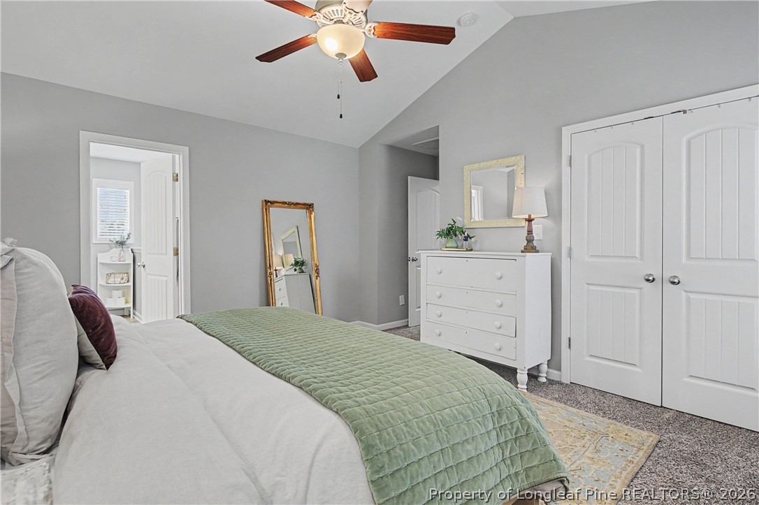 143 Ledgebrook Lane Raeford, NC 28376 - Photo 28 of 50 a bedroom with a bed and a chandelier