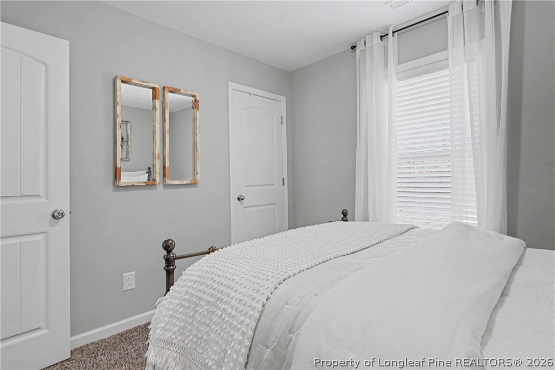 143 Ledgebrook Lane Raeford, NC 28376 - Photo 37 of 50 a bedroom with a bed and a window