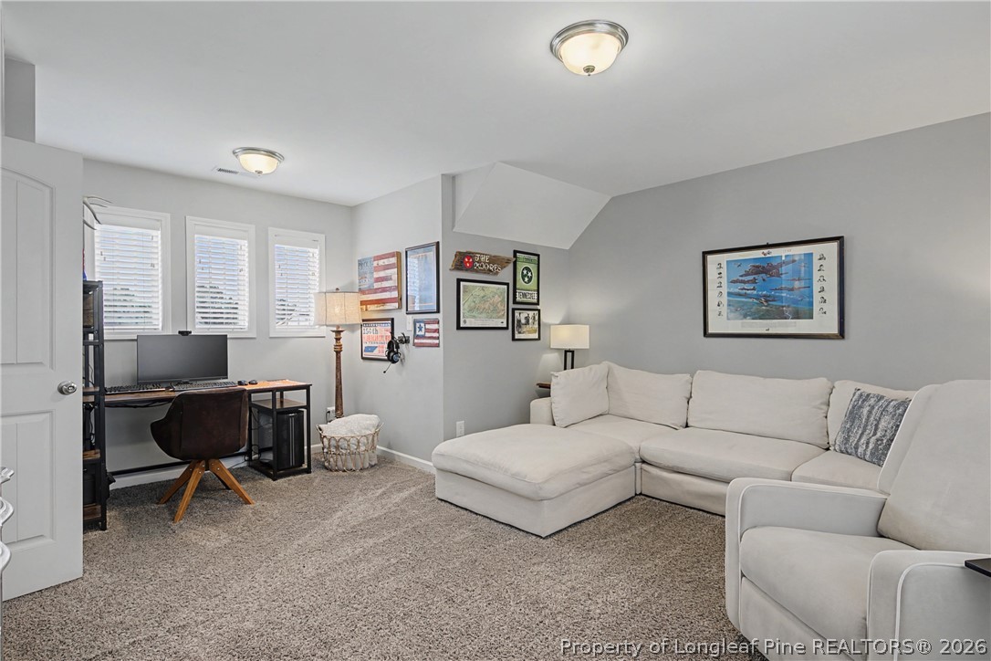 143 Ledgebrook Lane Raeford, NC 28376 - Photo 44 of 50 a living room with furniture and a couch