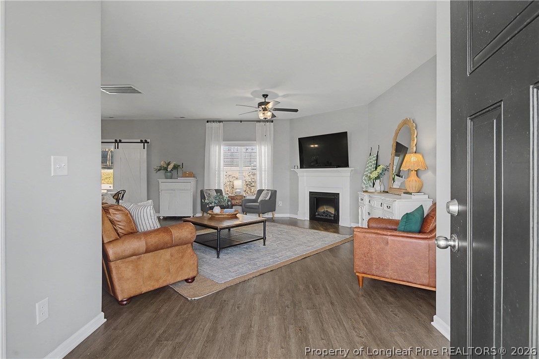 143 Ledgebrook Lane Raeford, NC 28376 - Photo 5 of 50 a living room with furniture and a fireplace