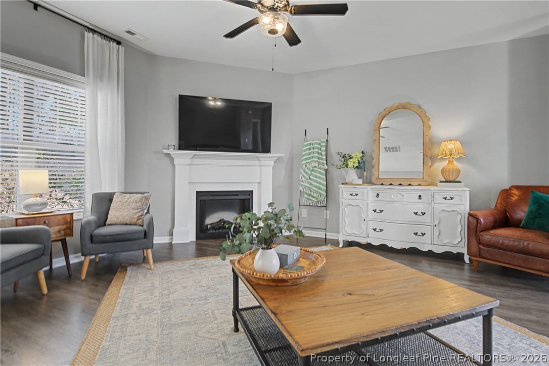 143 Ledgebrook Lane Raeford, NC 28376 - Photo 9 of 50 a living room with furniture fireplace and a flat screen tv
