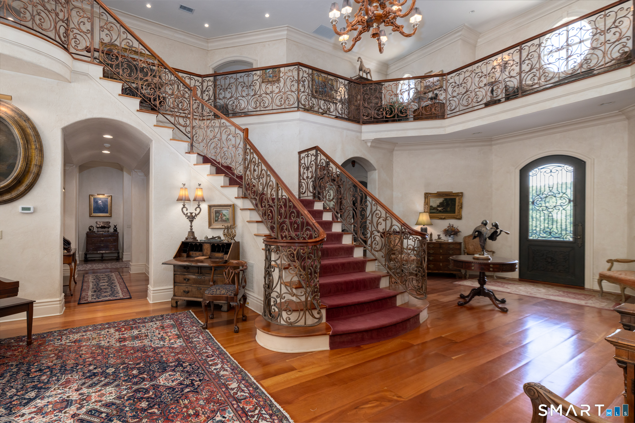 7 Equestrian Ridge Newtown, CT 06470 - Photo 5 of 40 a view of entryway with wooden floor and a chandelier
