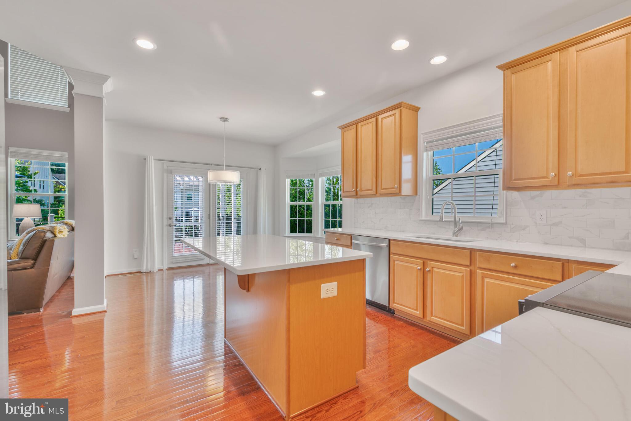 40652 Banshee Drive Leesburg, VA 20175 - Photo 20 of 51 a kitchen with stainless steel appliances granite countertop a sink a stove and a refrigerator