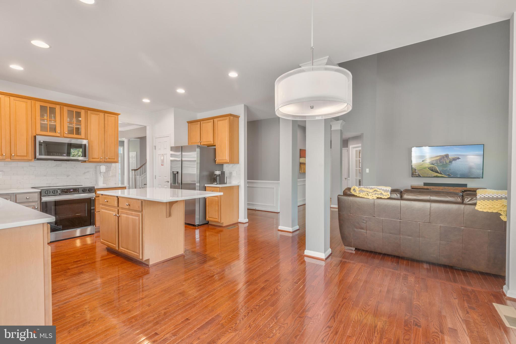 40652 Banshee Drive Leesburg, VA 20175 - Photo 22 of 51 a living room with furniture and a fireplace
