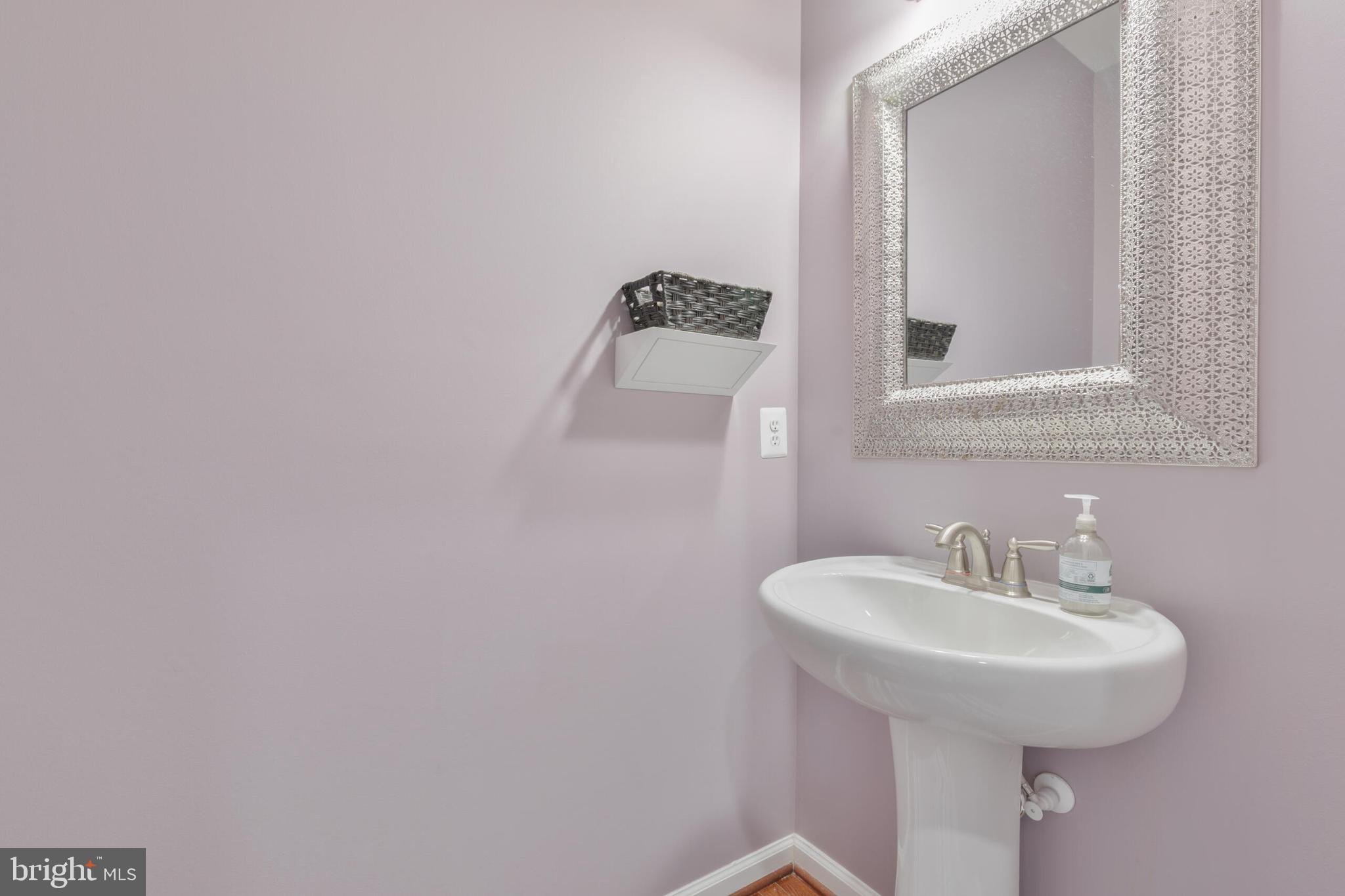 40652 Banshee Drive Leesburg, VA 20175 - Photo 23 of 51 a bathroom with a sink and a mirror