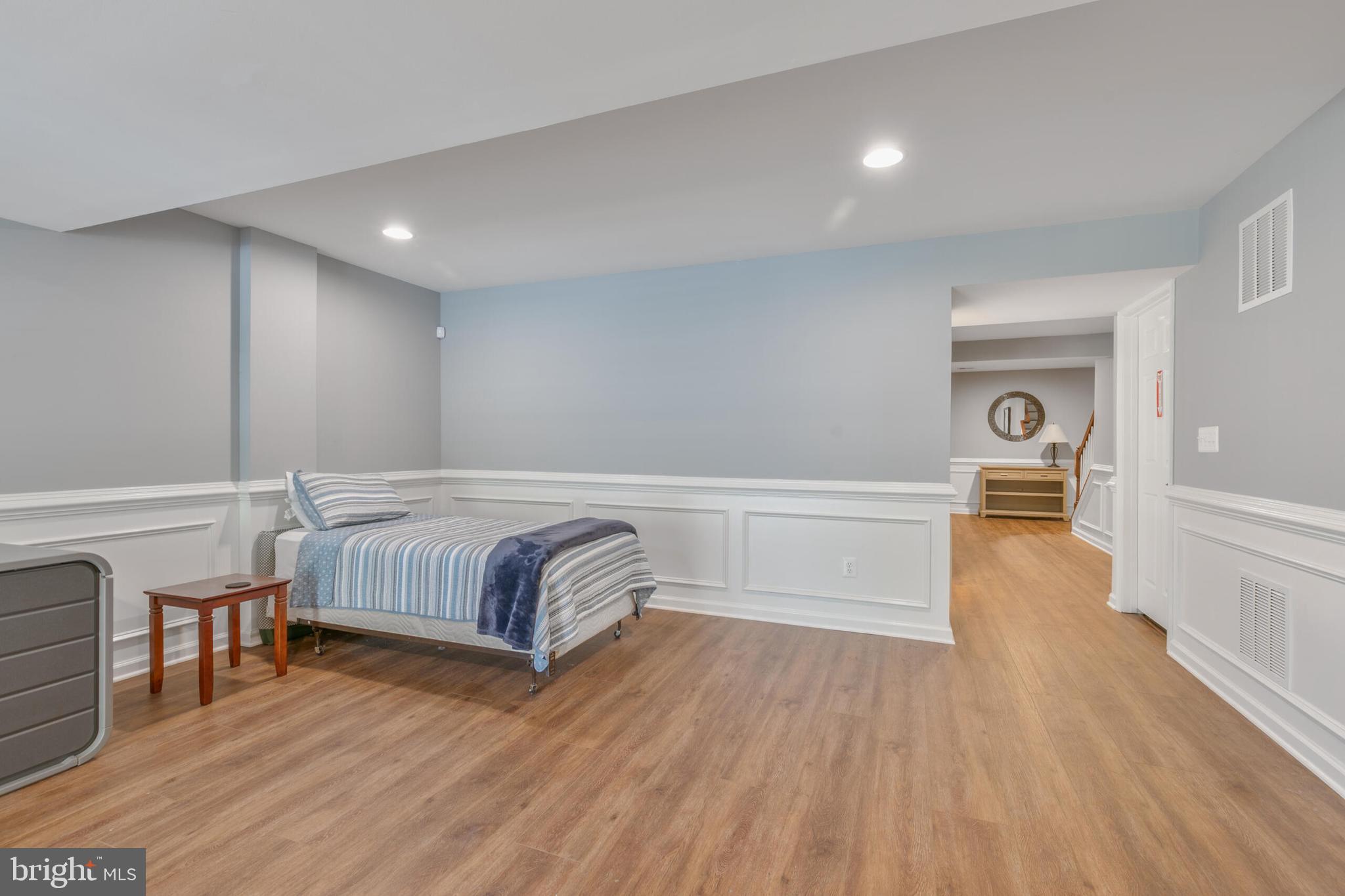 40652 Banshee Drive Leesburg, VA 20175 - Photo 38 of 51 a bedroom with a bed and wooden floor