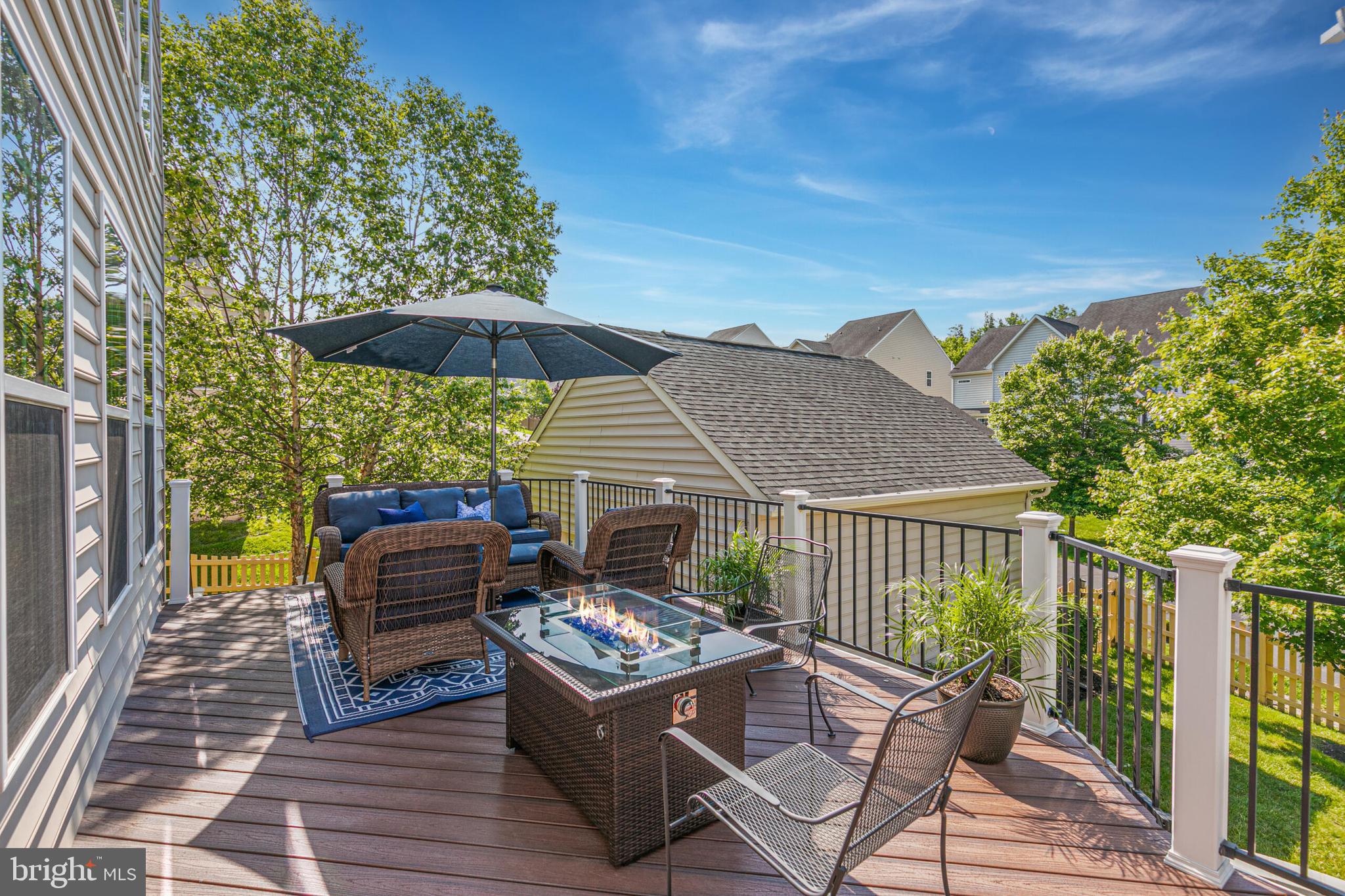 40652 Banshee Drive Leesburg, VA 20175 - Photo 40 of 51 a view of a patio with a table chairs and a barbeque