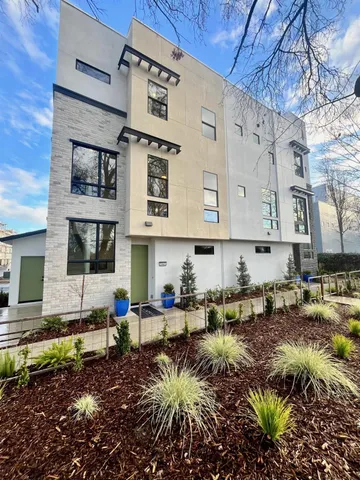 a view of a chairs and table in the backyard