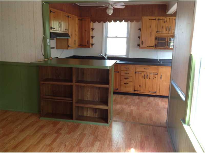 741 South State Line Road Sharon, PA 16146 - Photo 2 of 12 Kitchen. The kitchen with breakfast bar is open to the dining room. Both have laminate flooring.