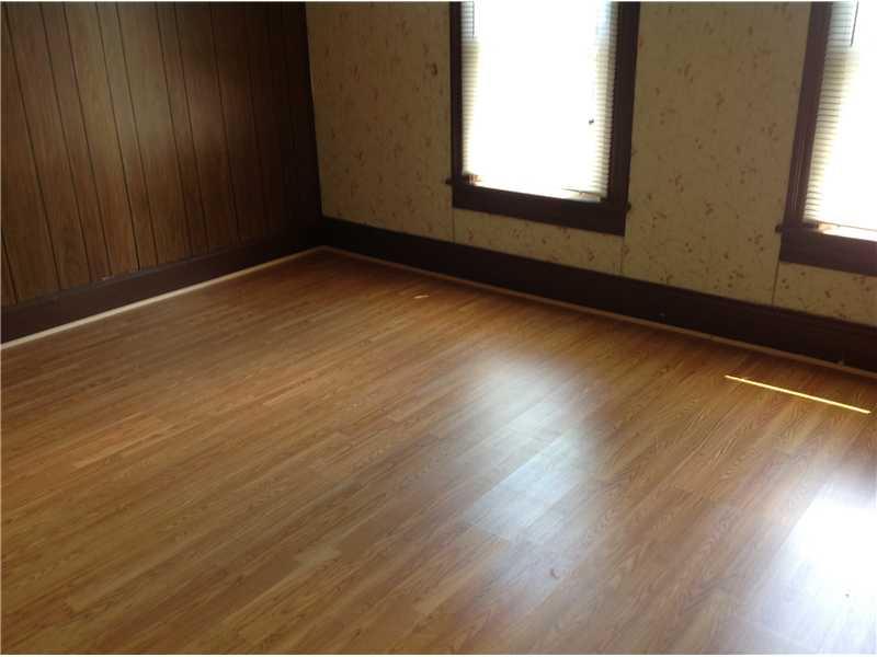 741 South State Line Road Sharon, PA 16146 - Photo 6 of 12 Master Bedroom. Laminate flooring is featured throughout the house, including this bedroom.
