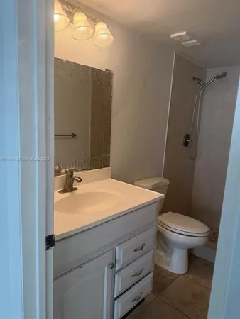 a bathroom with a sink and a toilet