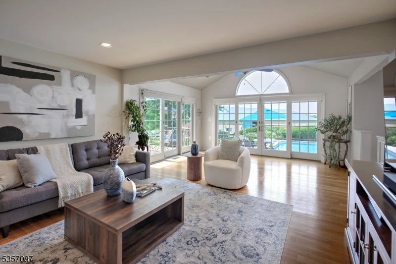 338 Rileyville Road Ringoes, NJ 08551 - Photo 19 of 33 a living room with furniture and a large window with garden view