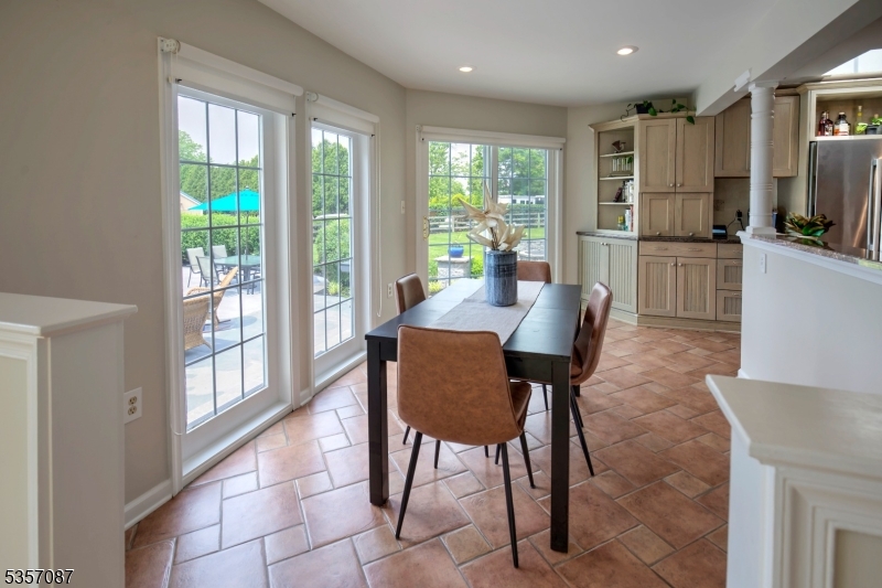 338 Rileyville Road Ringoes, NJ 08551 - Photo 24 of 33 a view of a dining room with furniture a kitchen and chandelier