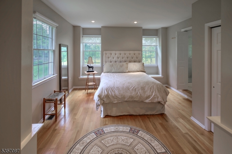 338 Rileyville Road Ringoes, NJ 08551 - Photo 29 of 33 a bedroom with a bed and wooden floor