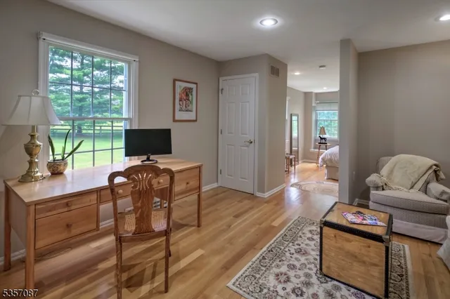 a living room with furniture window and a flat screen tv