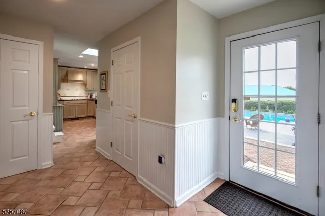 a view of a hallway with an entryway