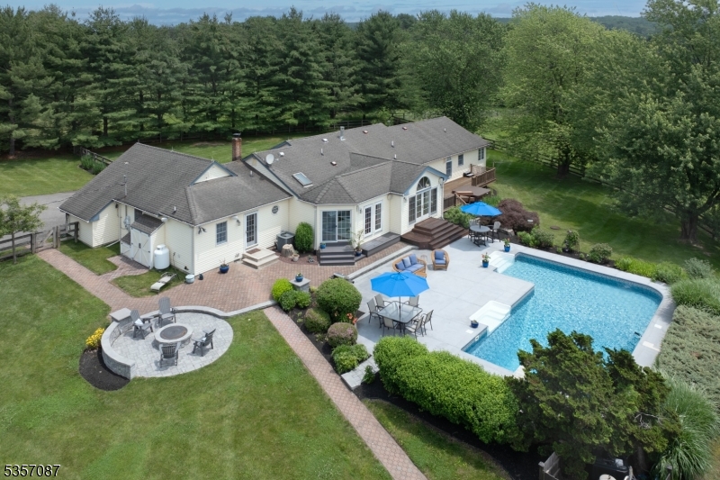 338 Rileyville Road Ringoes, NJ 08551 - Photo 4 of 33 an aerial view of a house with swimming pool patio and lake view