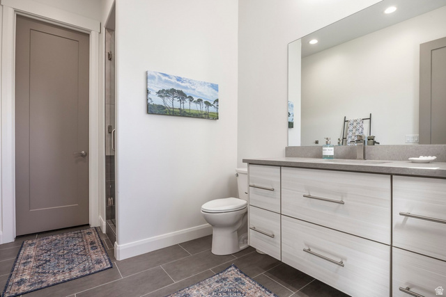 140 West Vista Road Kamas, UT 84036 - Photo 73 of 101 Floating double vanity with integrated sink, rectangular mirror, recessed lighting, and tile flooring