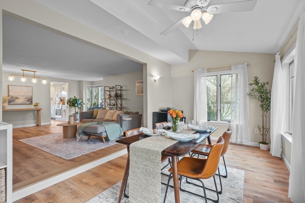 37 Constitution Lane, Unit 12 Danvers, MA 01923 - Photo 16 of 38 a living room with fireplace furniture and a wooden floor