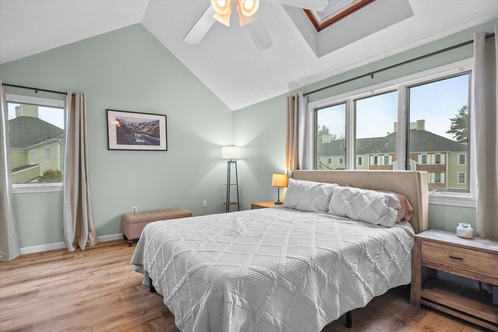 37 Constitution Lane, Unit 12 Danvers, MA 01923 - Photo 17 of 38 a bedroom with a large bed and a large window