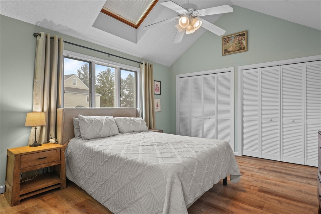 37 Constitution Lane, Unit 12 Danvers, MA 01923 - Photo 20 of 38 a bedroom with a large bed and a window