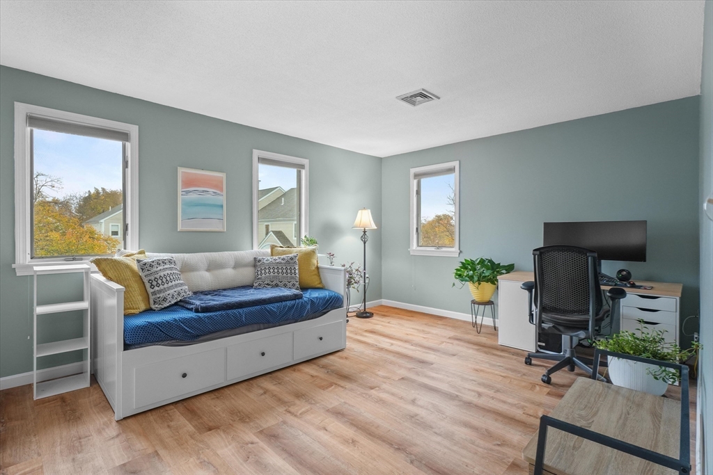 37 Constitution Lane, Unit 12 Danvers, MA 01923 - Photo 23 of 38 a living room with furniture and a window