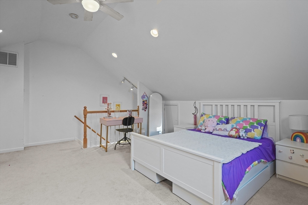 37 Constitution Lane, Unit 12 Danvers, MA 01923 - Photo 25 of 38 a bedroom with a bed and a window