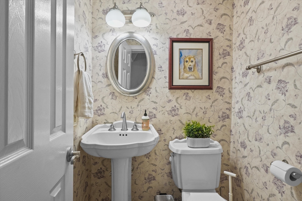 37 Constitution Lane, Unit 12 Danvers, MA 01923 - Photo 29 of 38 a bathroom with a sink and a mirror