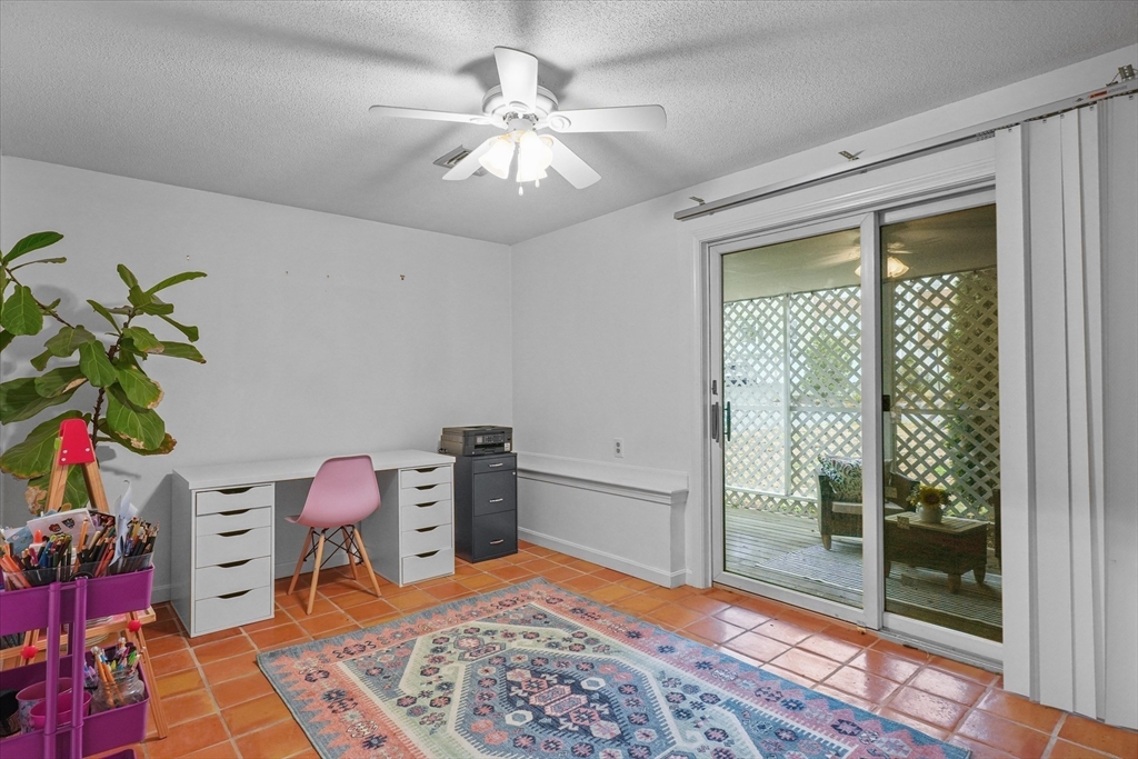 37 Constitution Lane, Unit 12 Danvers, MA 01923 - Photo 32 of 38 a room with furniture and a rug