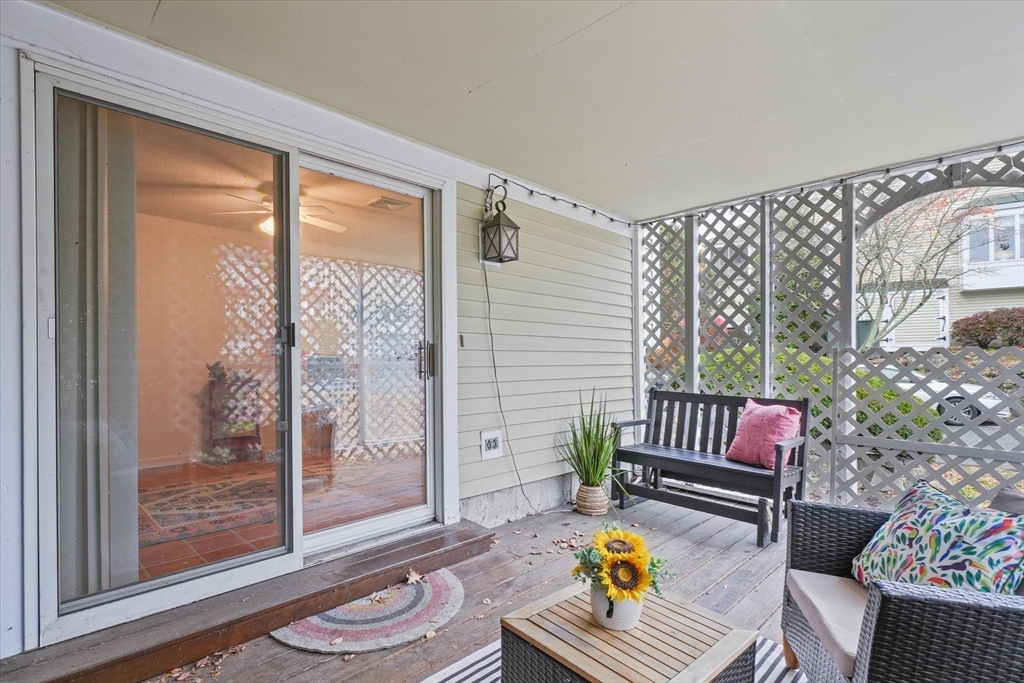 37 Constitution Lane, Unit 12 Danvers, MA 01923 - Photo 33 of 38 a living room with furniture and a window
