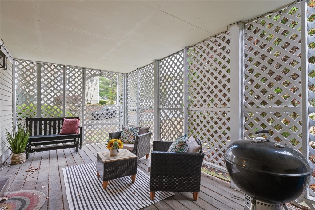37 Constitution Lane, Unit 12 Danvers, MA 01923 - Photo 34 of 38 a living room with furniture and a rug