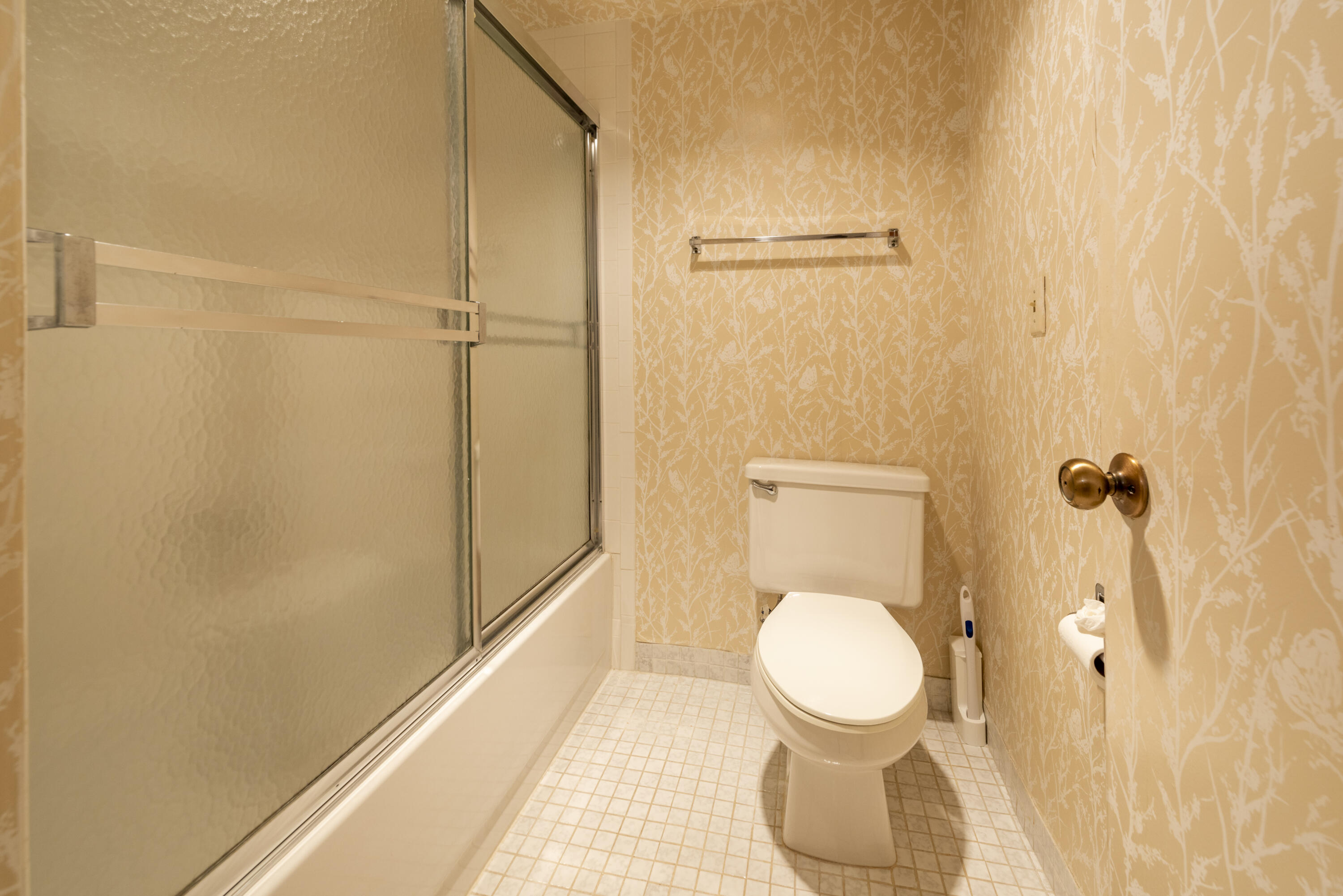 9199 Pecky Cypress Lane, Unit 7F Boca Raton, FL 33428 - Photo 14 of 20 a bathroom with a toilet and a shower