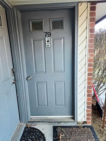 a view of a door and a window