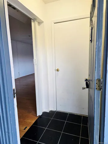 a bathroom with a glass shower door