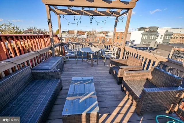 a view of a balcony with wooden floor