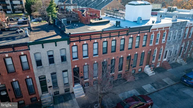 a view of a brick building with many windows