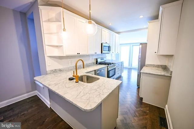 a dining table with chairs and window