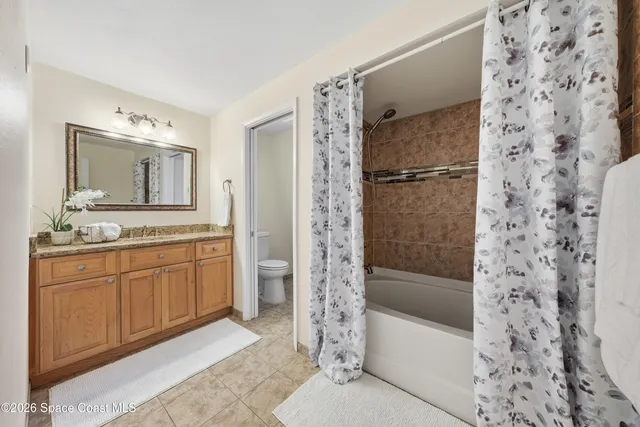 a view of a livingroom with furniture and hardwood floor