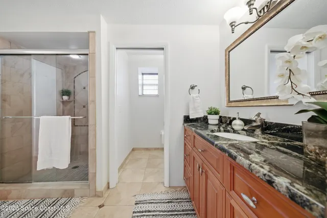 a view of a bathroom from a hallway