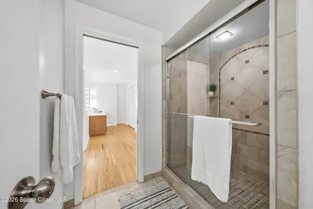 a room with a sink vanity and a mirror