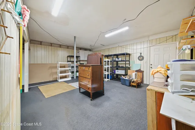 a view of yard with swimming pool and trees