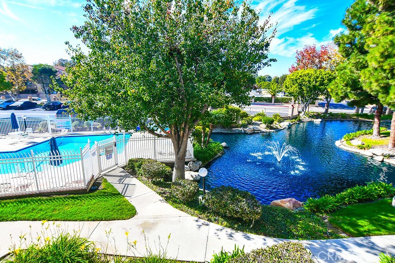 16551 Grunion Lane, Unit 204 Huntington Beach, CA 92649 - Photo 1 of 45 a view of a swimming pool with a patio