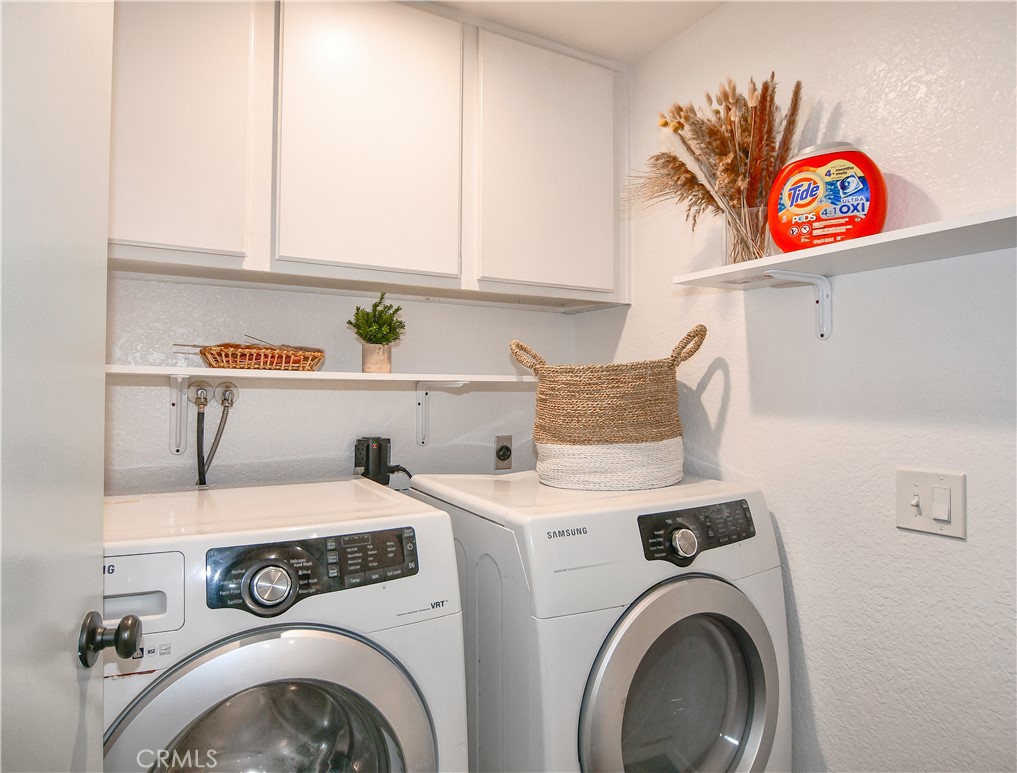 16551 Grunion Lane, Unit 204 Huntington Beach, CA 92649 - Photo 16 of 45 a utility room with dryer and washer
