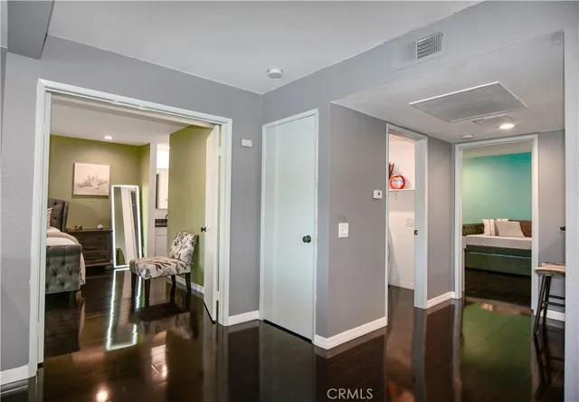 a bedroom with a bed and a mirror