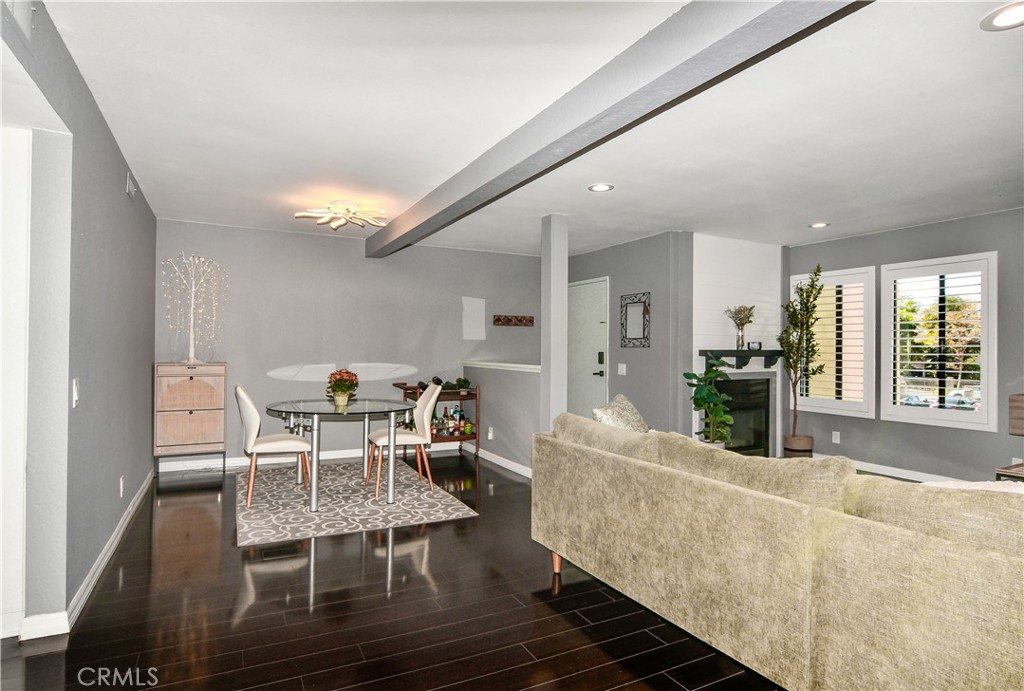 16551 Grunion Lane, Unit 204 Huntington Beach, CA 92649 - Photo 21 of 45 a living room with furniture and a table