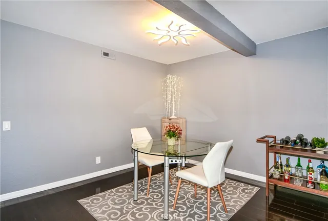 a room with furniture and a potted plant