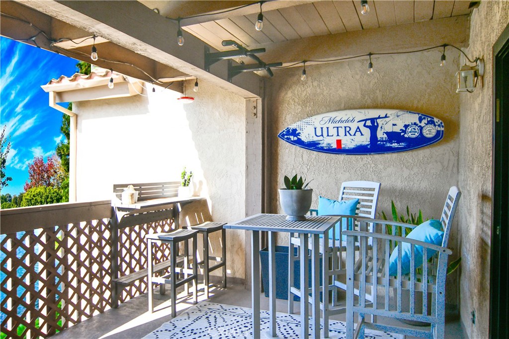 16551 Grunion Lane, Unit 204 Huntington Beach, CA 92649 - Photo 3 of 45 a view of a balcony with an outdoor space