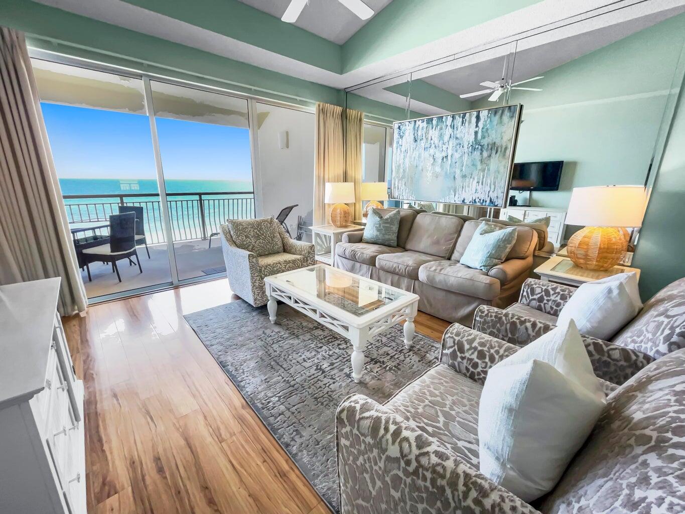 a living room with furniture and a large window