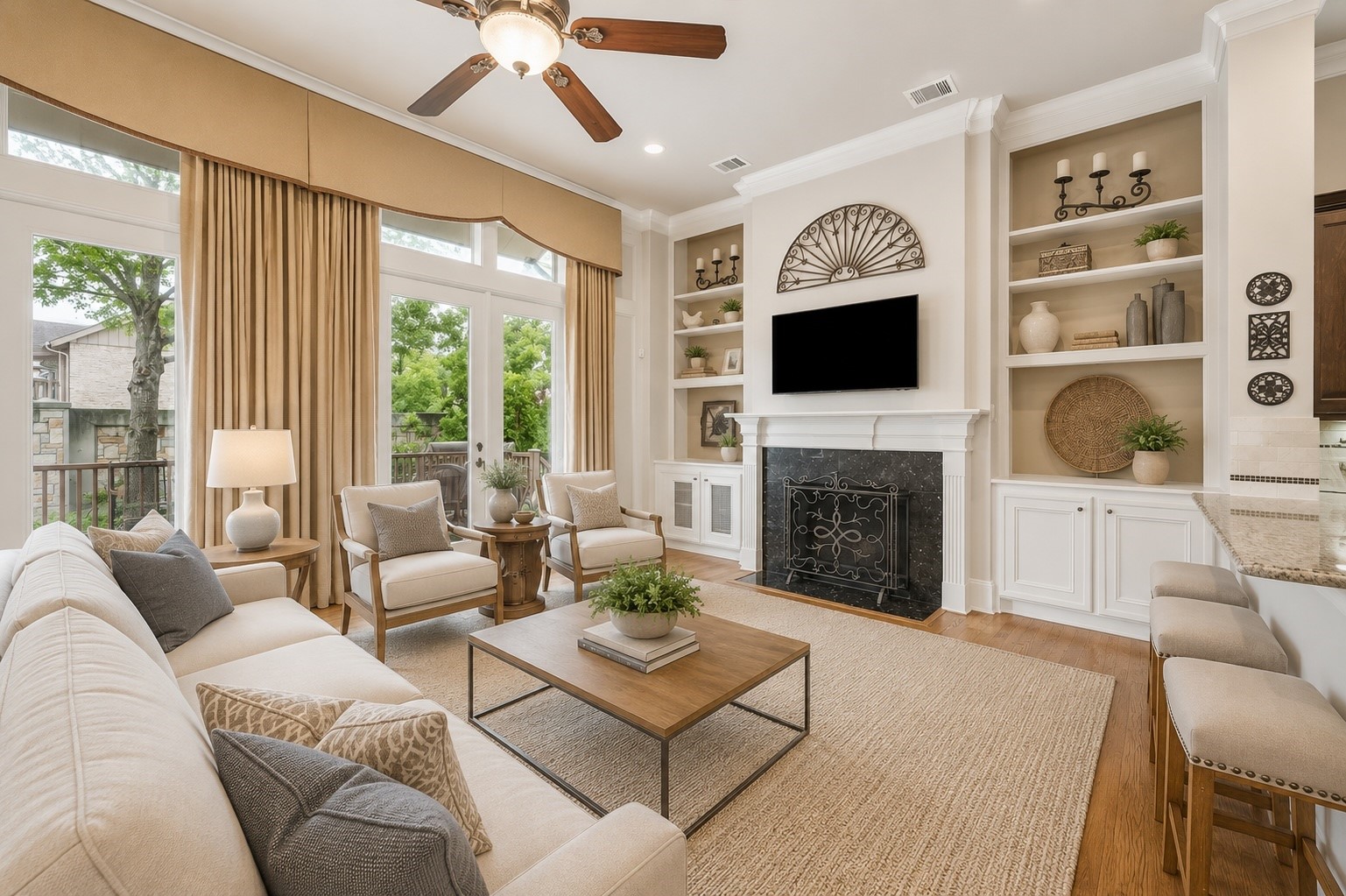 907 Queen Annes Road Houston, TX 77024 - Photo 5 of 31 Open-concept living area with soaring ceilings, custom built-ins, fireplace, and expansive windows overlooking the private outdoor space. This image has been virtually staged for illustrative purposes.